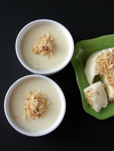 Firm coconut pudding set in molds, sliced cleanly on a plate